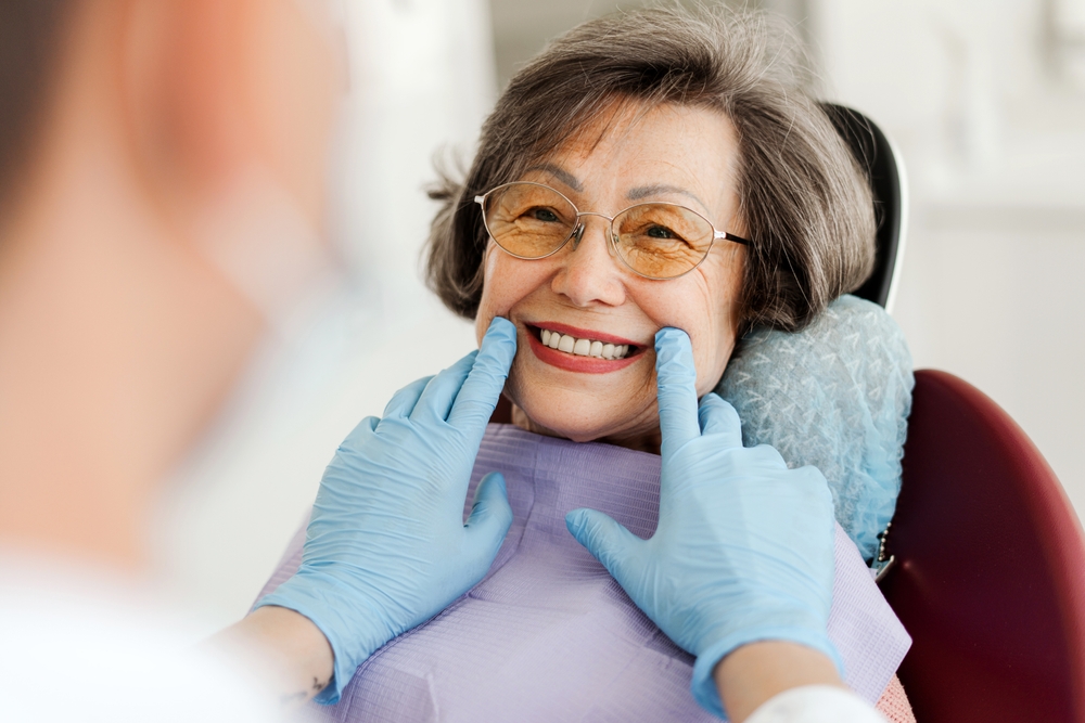 Smiling,,Happy,,Beautiful,Senior,Woman,Sitting,In,Dental,Chair,,Dentist